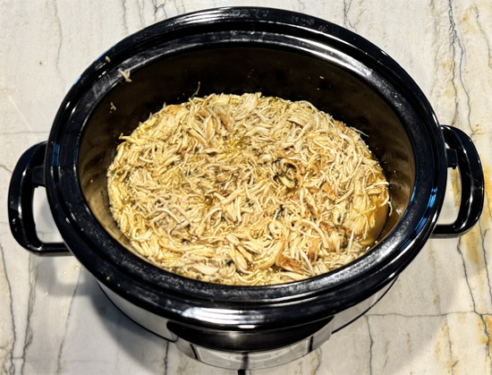 Return to slow cooker and stir with the cooking juices and cilantro.