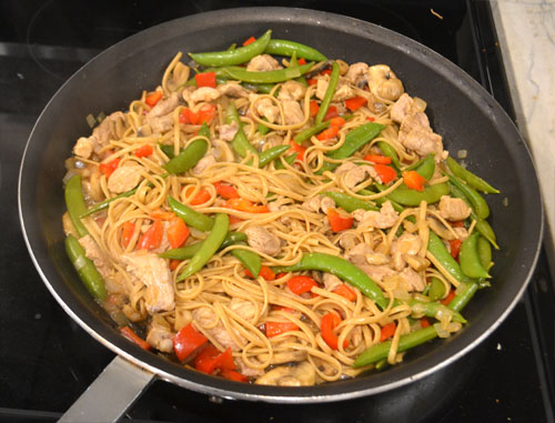 Pork Lo Mein in a Pan Cooking with Linquine Mixed In