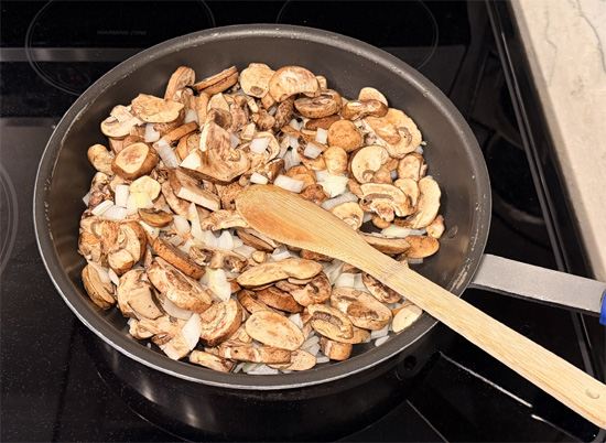Heat olive oil in a large sauté pan over medium-high heat. Add mushrooms, onions, and 1/4 teaspoon salt. 