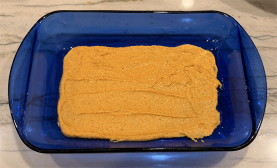 Spread 1 cup pumpkin sauce in bottom of prepared baking dish. Place 3 noodles across the pan (space between them is okay). 