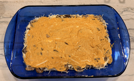 Repeat: 1 cup pumpkin sauce, 3 noodles, remaining ricotta mixture, and 1 cup cheese mixture. 