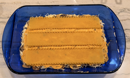 Repeat: 1 cup pumpkin sauce, 3 noodles, remaining ricotta mixture, and 1 cup cheese mixture. 