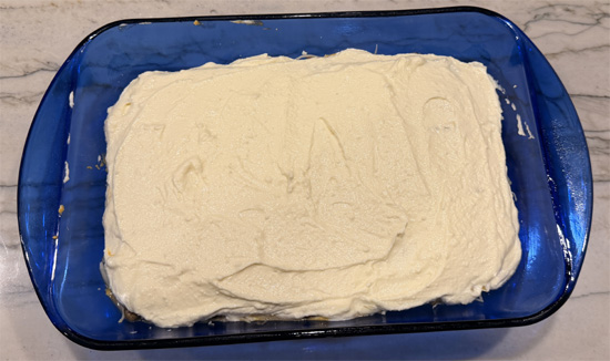 Repeat: 1 cup pumpkin sauce, 3 noodles, remaining ricotta mixture, and 1 cup cheese mixture. 