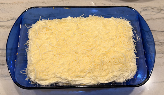 Repeat: 1 cup pumpkin sauce, 3 noodles, remaining ricotta mixture, and 1 cup cheese mixture. 