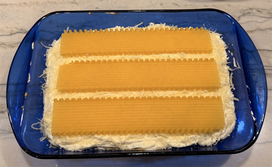 Top with remaining 3 noodles, spread with remaining pumpkin sauce, add remaining mushroom mixture, and finish with remaining cheese.