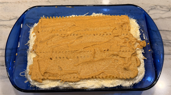 Top with remaining 3 noodles, spread with remaining pumpkin sauce, add remaining mushroom mixture, and finish with remaining cheese.