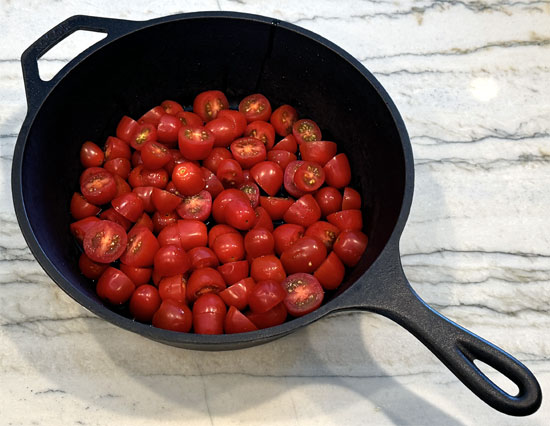 In an oven-safe baking dish, combine tomatoes, shallots, garlic, salt, feta cheese, olive oil, and Italian seasoning. Mix well.