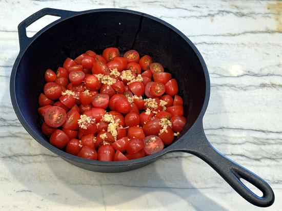 In an oven-safe baking dish, combine tomatoes, shallots, garlic, salt, feta cheese, olive oil, and Italian seasoning. Mix well.