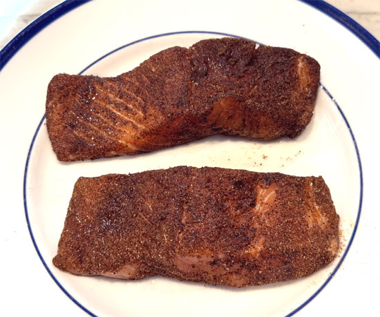 Lightly spray olive oil on both sides of the salmon fillets. Then cover the fillets with the spice blend. Sprinkle 2 tablespoons of the lime juice of the fillets.