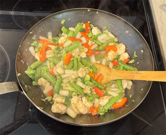 Add the shrimp. Stir constantly for 2–3 minutes, until the shrimp turn opaque (white) and are cooked through.