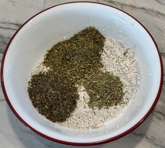 Mix seasoning: In a small bowl mix together the 8 seasoning ingredients, cornstarch, salt, black pepper, garlic powder, onion powder, oregano, basil and rosemary. Set aside. 