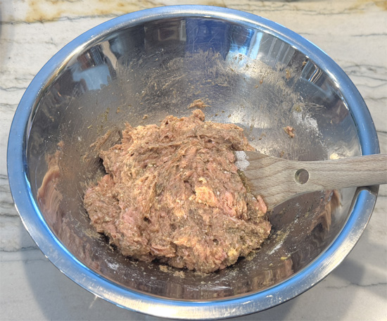 Stir in the seasoning ingredients: Put 1/3 of the seasoning in at a time, mix it into the turkey, then add more until it's thoroughly combined. 