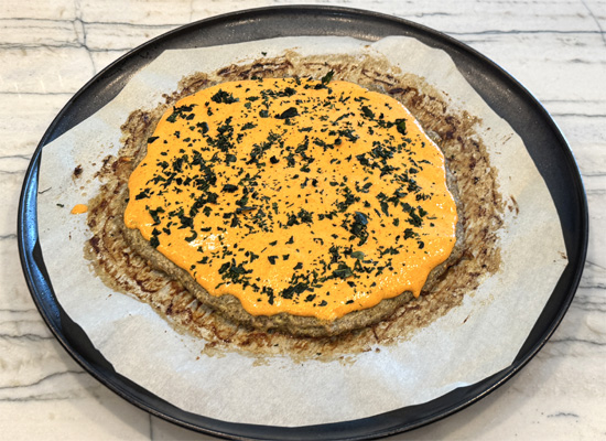 Add basil: Sprinkle basil over the sauce.