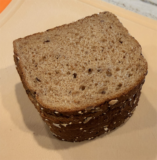 Cut the bread into small 1 inch squares. Spread the bread squares on the prepared baking sheet. Spray with olive oil and sprinkle with 1 Tbsp Everything Bagel seasoning. Bake 8 minutes, flip, spray again, and bake another 8 minutes until crunchy. Set croutons aside.