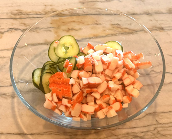 Chop imitation crab and add to the bowl along with the seaweed wraps, cut into small pieces. Toss to combine.