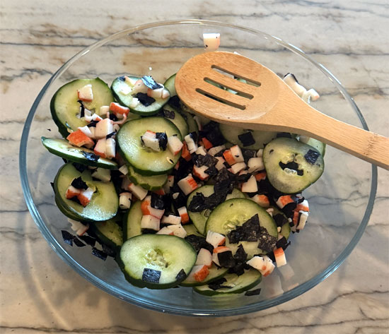 Chop imitation crab and add to the bowl along with the seaweed wraps, cut into small pieces. Toss to combine.