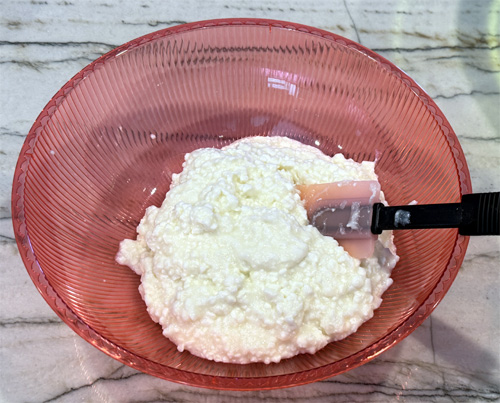 Pour the cottage cheese into a bowl.