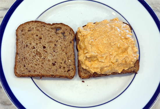 Top with the buffalo chicken mixture and cheddar cheese. Add the second slice of toast.