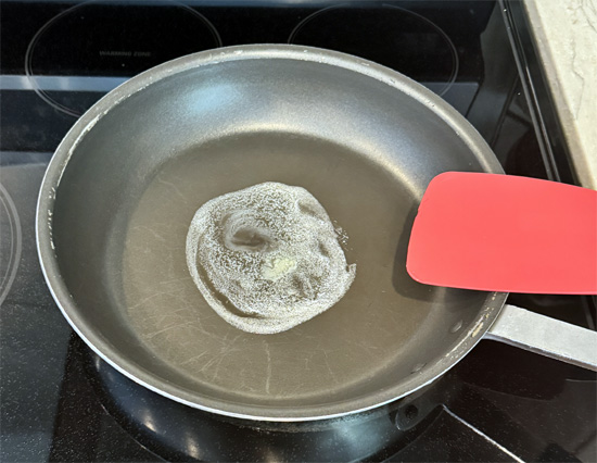 Heat a non-stick pan over medium heat. Add half the butter and let it melt.