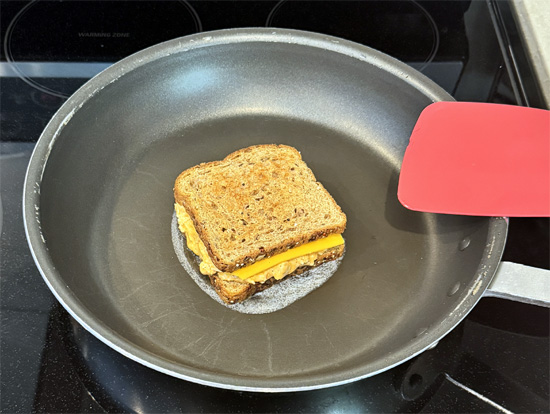 Place sandwich in the pan and cook for 3-4 minutes until golden brown.