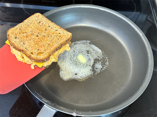 Add remaining butter to the pan, flip sandwich, and cook another 3-4 minutes until the second side is golden brown.