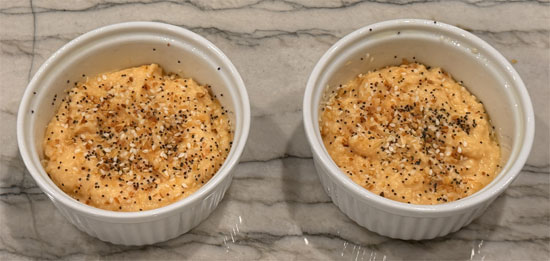 Divide mixture between the two ramekins and sprinkle everything bagel seasoning on top.