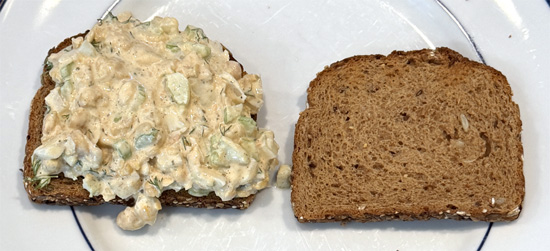 Spread about 1/3 cup of the chickpea salad onto one slice of toasted bread. Top with the second slice.
