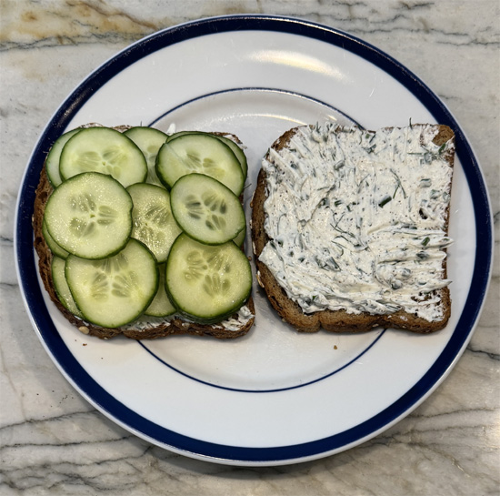 Layer the cucumber slices on one side of the bread. 