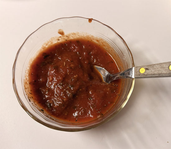 In a small microwave-safe bowl, stir together the marinara, basil, and garlic powder, then microwave until warmed through, 30 seconds to 1 minute, and stir again. You'll use half in the sandwich and serve the rest for dipping.