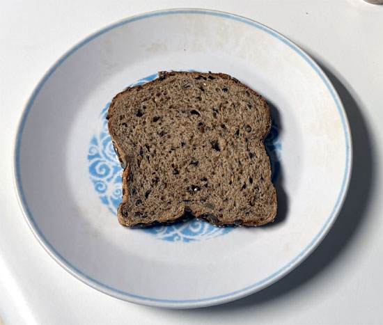 Assemble the sandwich: one slice of bread butter side down, a slice of provolone, 2 tablespoons marinara, the chicken patty, 2 more tablespoons marinara, the second slice of provolone, and the last slice of bread butter side up.
