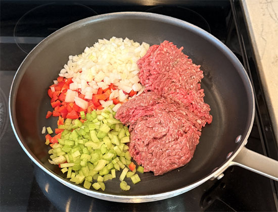 In a large skillet or Dutch oven, cook the ground beef, celery, bell pepper, and onion over medium heat, breaking up the meat as it cooks, until the beef is browned and the vegetables are softened, about 6-9 minutes.