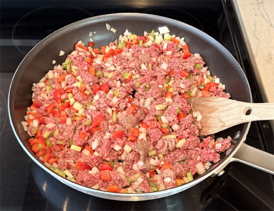In a large skillet or Dutch oven, cook the ground beef, celery, bell pepper, and onion over medium heat, breaking up the meat as it cooks, until the beef is browned and the vegetables are softened, about 6-9 minutes.