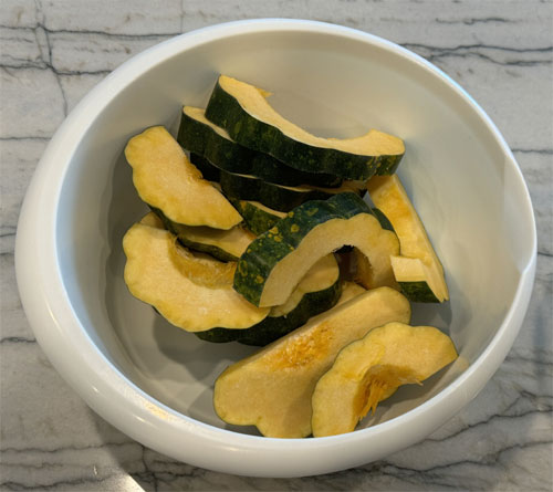 Lightly coat the squash with olive oil. I like using a mister with olive oil in it. Then, coat both sides with the squash in the cheese and herb mixture. 
