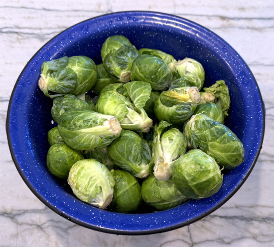 While the pot is heating up, trim the stems of the Brussels sprouts. Leave as much on as possible so they hold together when you smash them. If they're especially large, you can cut them in half; just be aware that they won't be held together. 
