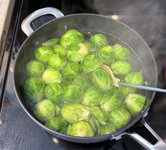 Add the Brussels sprouts to the hot water and boil for about 10 minutes until they're fork-tender. 