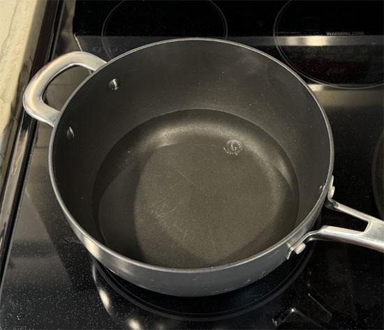 Fill a pot with 2-3 cups of water and bring to a boil over high heat.