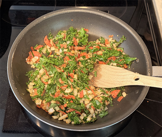 Stir the kale in to wilt it. Cook, mixing together for another 2-3 minutes until the kale is wilted and deep green. 