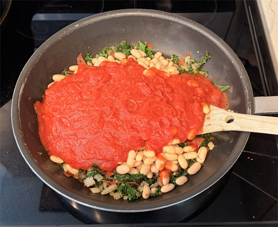 Stir in the cannellini beans and pasta sauce. 