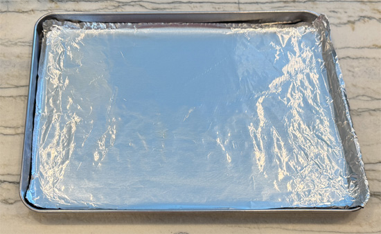 Lightly grease a baking sheet with olive oil. Set aside.