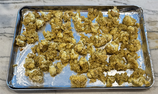 Bake the cauliflower until golden brown, and the cauliflower is tender about 25-30 minutes.