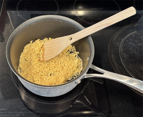 In a medium saucepan, heat 1 tablespoon of olive oil over medium heat. Add the rice and stir frequently for 2–3 minutes, until it’s lightly toasted and fragrant.