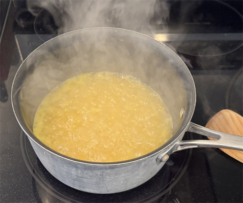 Pour the chicken or vegetable broth into the saucepan and bring to a boil. Reduce heat to low, cover, and simmer for 15–18 minutes or until the rice is tender and the liquid is absorbed—fluff with a fork when done.