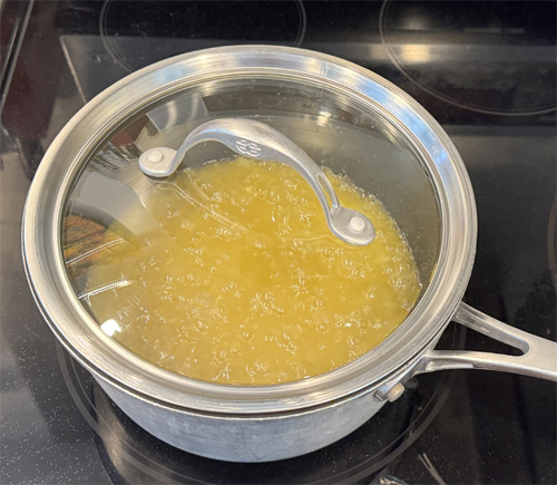 Pour the chicken or vegetable broth into the saucepan and bring to a boil. Reduce heat to low, cover, and simmer for 15–18 minutes or until the rice is tender and the liquid is absorbed—fluff with a fork when done.