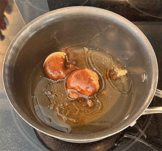 In a saucepan over medium heat, stir together the sugar free brown sugar, light corn syrup, canola oil and sugar free honey, stirring until the sugar fully dissolves, about 3-4 minutes.