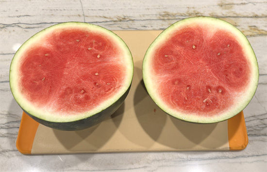 Start by cutting your watermelon in half, right through the middle.
