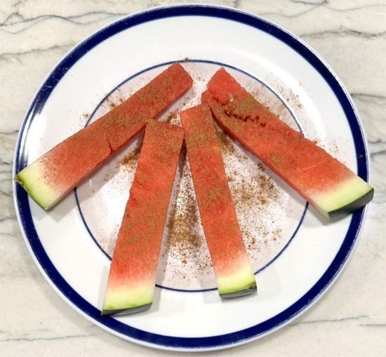 Arrange the watermelon pieces on a platter or tray.