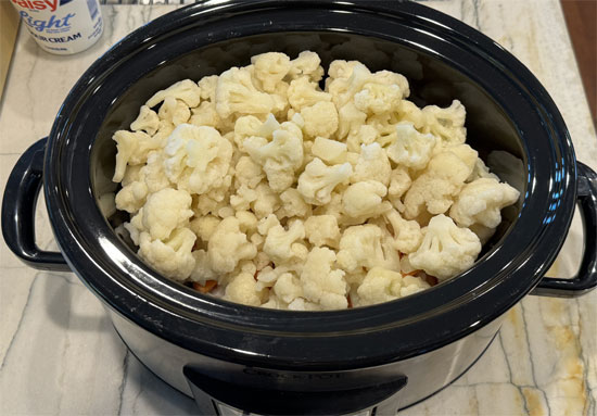 Add the frozen carrots and cauliflower next.