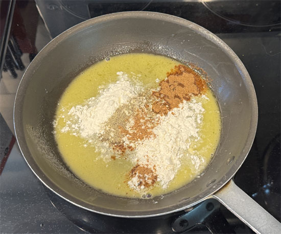 6. Stir in the flour, milk, half and half, pepper, bouillon and nutmeg. Stir as it warms up for about 2 minutes.