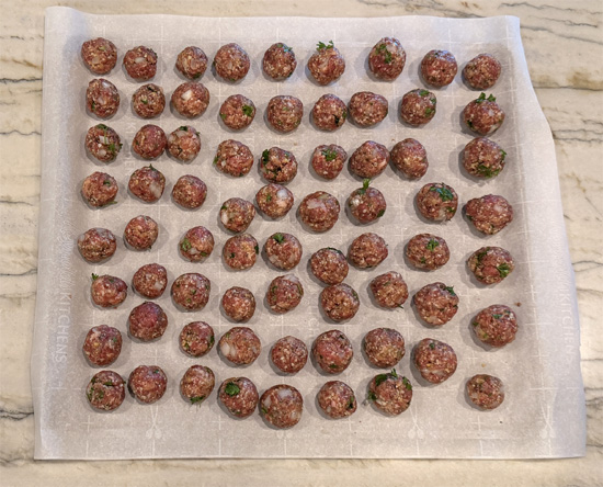 Line a tray or baking sheet with parchment. Roll the mixture into thumb-sized meatballs and place them on the parchment in a single layer.