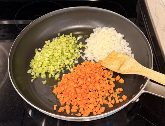 In a large pot or deep skillet, heat the olive oil over medium heat. Add the onion, celery, and carrots and cook, stirring occasionally, until softened, about 5–7 minutes.